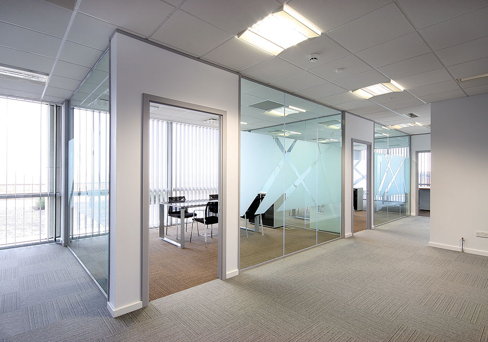 Office glass partition installation in progress